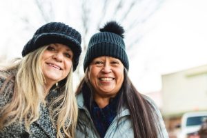 Multiracial Friends in Small Town Western USA Christmas Shopping Together Fostering Friendship Holiday Photo Series