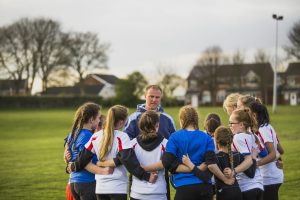 Rugby Girls Team Huddle